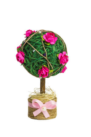 Homemade decorative tree with pink rosesの写真素材