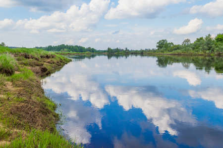 Clouds reflected in the river Mologaの写真素材