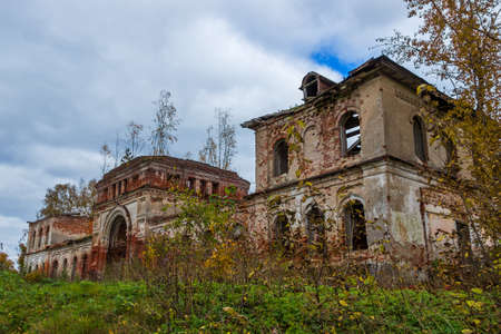 A derelict outbuilding to a dilapidated Church. The Village Of Rybinsk-Zaruch'ye.の写真素材