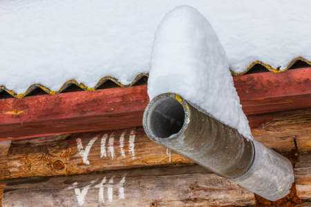 The snow on the tube from the bath. Early winter this year in the village.の写真素材