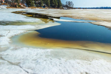 Ice on the river bursts. Spring. Mologa River. The ice begins to crack and the ice drift is about to begin.の写真素材