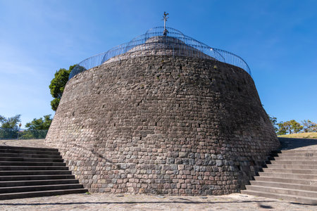 A low-angle view of "El Churo de la Alameda," the distinctive conical stone structure reminiscent of a snail, located in the historic La Alameda Park in Quito, Ecuador.の写真素材