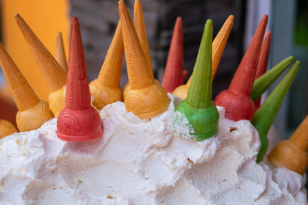 Close-up of espumilla, a traditional Ecuadorian dessert. This meringue and fruit foam is served in colorful ice cream cones and is a typical sweet found in Andean markets and street foodの写真素材
