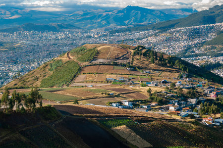 Panoramic view showing the contrast and transition in the urban-rural edge of Quito, a large Andean city.の写真素材