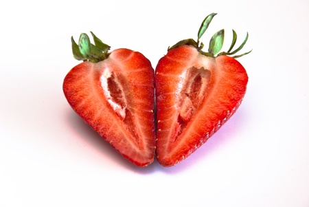 a strawberry split into two, with the two halves side by side. Macro photoの写真素材