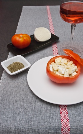 Tomatoes stuffed with buffalo mozzarella cheese with spicesの写真素材