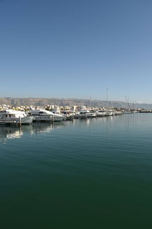Touristic Harbor with boats and seascape by morningの写真素材