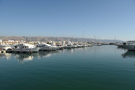 Touristic Harbor with boats and seascape by morningの写真素材