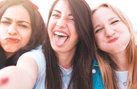 Group of best friends on vacation take a selfie - Happy friends have fun together during the trip...