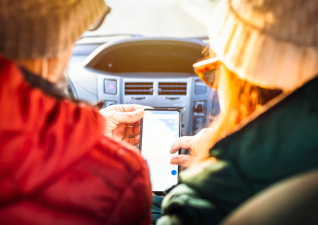 Retirees check the directions on their smart phone using gps - Middle aged couple on vacation...