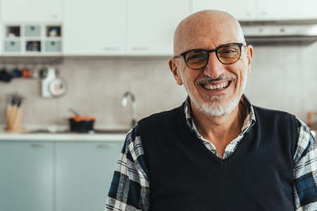 Portrait of a middle aged man looking into the camera - copy space on the leftの写真素材