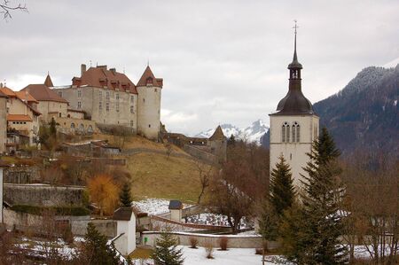 Gruyere castle and church in winterの写真素材