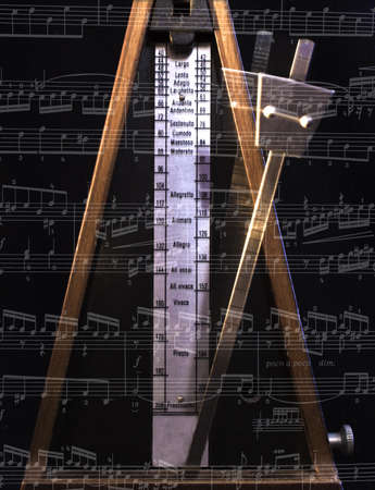 Old metronome with blur motion on the blackの写真素材
