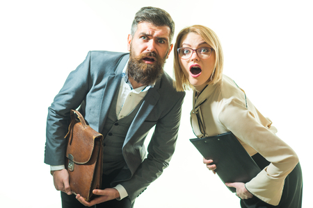 Education, business, job, occupation, profession and people concept - surprised teachers, businessmen, office workers. Educational theme: amazed male and female teachers holds briefcase and folder.の写真素材