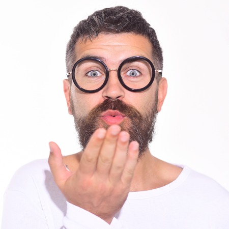 Bearded man in black glasses sand a kiss. Different emotions. Stylish fashion man. Feeling and emotions. Face expression.の写真素材