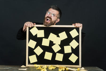 Notes. Business, management, reminder and people concept. Bearded handsome businessman with glasses...