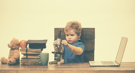 Science. Wunderkind concept. Primary school concept. Smart small boy, scientist child works with...