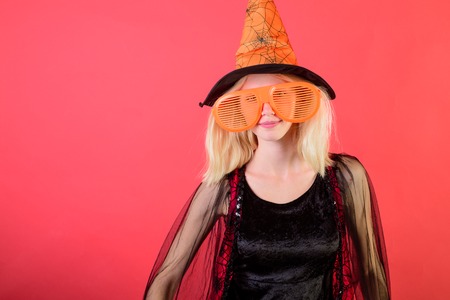 Wizards&costume party. Sexy witch in big striped sunglasses. Halloween wizard. Holiday, carnival costumes. Girl on Halloween party. Halloween outfit, holiday. Secrets mystery Halloween. October party.の写真素材