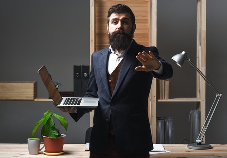 Business, office, warning, disagreeing, rejecting concept. Businessman rejecting an inappropriate proposal. Boss with serious face making stop sign. Agreement cancellation. Rejecting offer.Please waitの写真素材