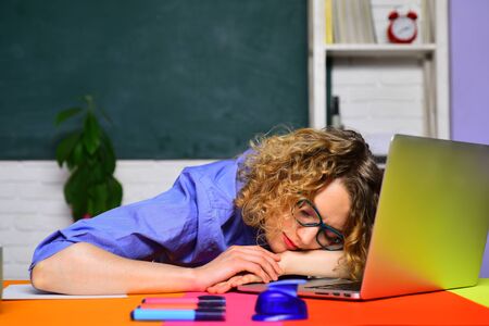 Teachers day. Learning and education. Preparing for exam in college. Tired teacher sleep. Knowledge day. Education concept. E-learning. Online test. Woman tutor.の写真素材
