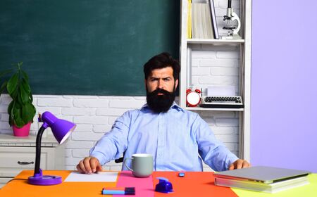 Serious teacher in classroom. Teachers day. Bearded teacher. Learning and education concept. Professor. Preparing for exam in college.の写真素材