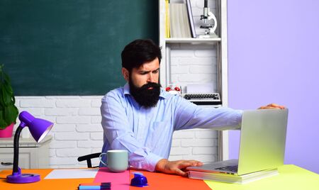 Teacher preparing for university exams. Teachers day. Bearded teacher. Learning and education concept. Portrait of male student indoors. Knowledge day.の写真素材