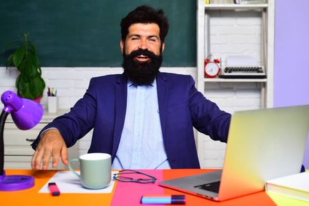 Knowledge day. Student and tutoring education concept. Teacher preparing for university exams. Teachers day. Young teacher. Preparing for exam in college. Portrait of male university student indoors.の写真素材