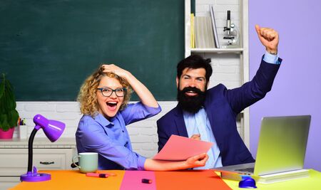 World teachers day. University students at college. Male and female teachers in auditorium. Back to school. School job. Students studying in the classroom. Young happy students. School students.の写真素材