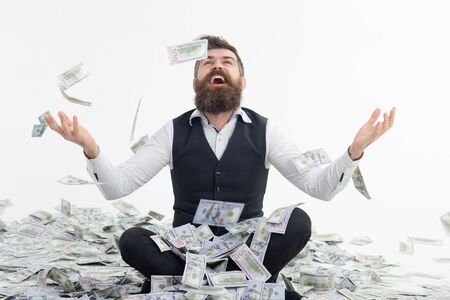 Businessman throwing dollars. Dollars raining. Millionaire man.の写真素材