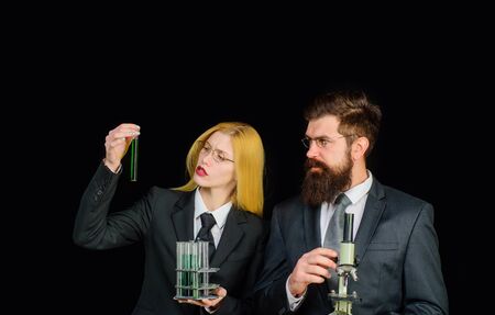 Research in clinical laboratory. Science, chemistry, biology, technology and people concept. Scientists with test tube and microscope. Modern education. Lab experiment. Microscope and testtubes. STEM.の写真素材