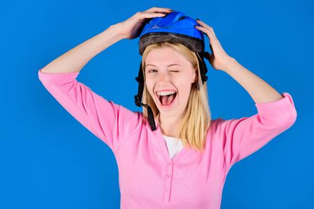 Girl in bicycle helmet. Female cyclist in sport helmet. Smiling sporty woman wearing biking helmet. Cycling woman in biking protective helmet ready for workout. Sporty lifestyle and recreation conceptの写真素材