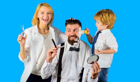 Barbershop. Bearded man. Barber shop tools. Hairdresser making hairstyle. Beard care. Hair preparation. Bearded man in barbershop. Hipster. Foam for shaving. Barber scissors and razor.の写真素材