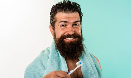 Dental hygiene. Cleaning teeth. Smiling man with tooth brush. Tooth paste. Morning treatments....