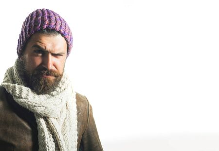 Handsome stylish man in elegant autumn clothing. Men fashion. Trendy guy in autumn-winter clothes. Fashionable man in fall clothes. Casual fashion. Demi-season wear.Man in fashionable cap, scarf, coatの写真素材