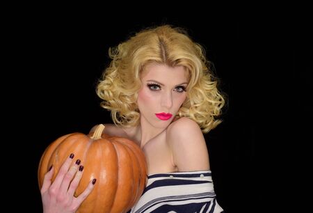 Trick or treat. Woman with Pumpkin. Halloween party. Happy halloween.の写真素材