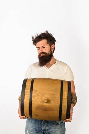 Oktoberfest. Serious bearded man drink beer. Enjoy in pub. Barrel of beer. We meet oktoberfest. Beer time. Brew. Oktoberfest festival. Bearded man with barrelの写真素材