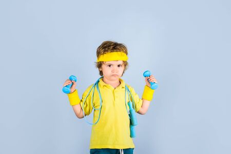 Childhood activity. Fitness, health and energy. Sport. Fitness child. Sporty boy with jump rope and...