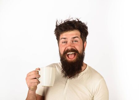 Refreshment and energy. Morning coffee concept. Cheerful man having cup of coffee in kitchen. Happy...