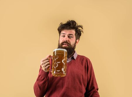 Oktober fest. Barman. Brewer. Oktoberfest festival. Tasting fresh brewed beer. Brewer holds glass...