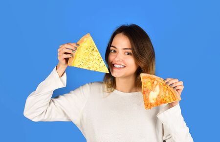 Smiling woman eating pizza. Woman with pizza slices. Food. Lunch. Happy girl holding pizza slices in hands. Fastfood. Snack. Food delivery. Pizza sliceの写真素材