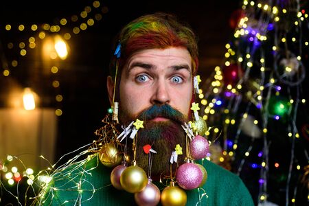 Surprised Santa Claus hold Christmas tree. New year clothes. New Year eve. Santa in home. Santa Claus. Merry Christmas and happy New year. Wish you merry Christmasの写真素材