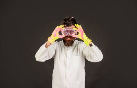 Bearded cleaner. Household. housework. Housekeeping. Cleaning concept. Cleaning service. Cleaners. Domestic housework. Cleaning equipment. Man with foam on face. Cleaning advertising. Male homemakerの写真素材