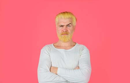 Barbershop. Bearded man with dyed blonde hair. Handsome man with stylish haircut. Blonde hipster...