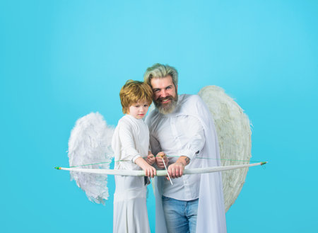 Cute angel kid. Happy father in angel costume with little son angel. Father and son Angels. Father's...