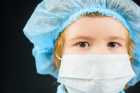 Protection from infection. Boy in medical respiratory protective mask. Face mask for protection  outbreak.の写真素材