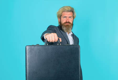 Business. Office worker. Serious businessman with suitcase. CEO. Bearded businessman in suit....
