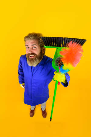 House cleaning. Broom. Bearded man with cleaning equipment. Professional cleaning. Cleaning service....