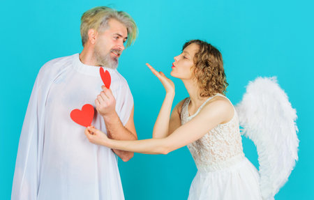 Valentines Day. Angel with red hearts. Couple in tender passion. Valentine day. Relationships.