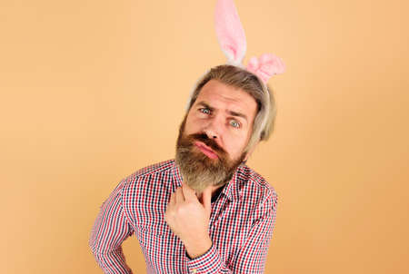 Rabbit man. Easter Day. Confused guy with bunny ears. Man in bunny ears.の写真素材