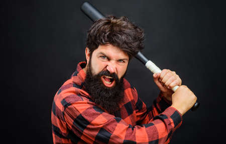 Angry bearded man with baseball bat. Sport equipment. Professional baseball player.